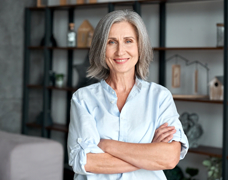 Senior woman in house smiling with All-on-4 implants in Ledgewood, NJ