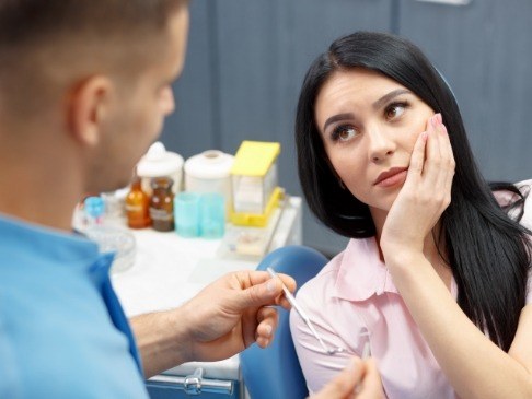 Woman in pain before tooth extractions