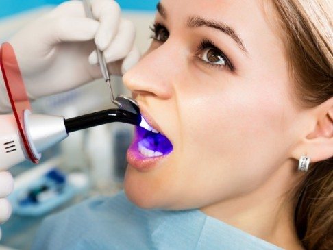 Patient receiving cosmetic dental bonding