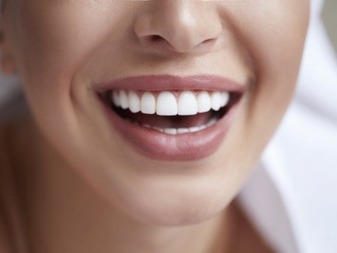 Dental patient sharing bright smile after teeth whitening