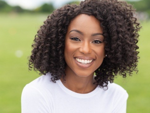 Woman sharing flawless smile after makeover