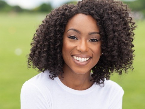 Woman sharing flawless smile after makeover