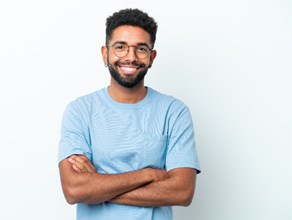 Man with confident smile thanks to cosmetic dental services