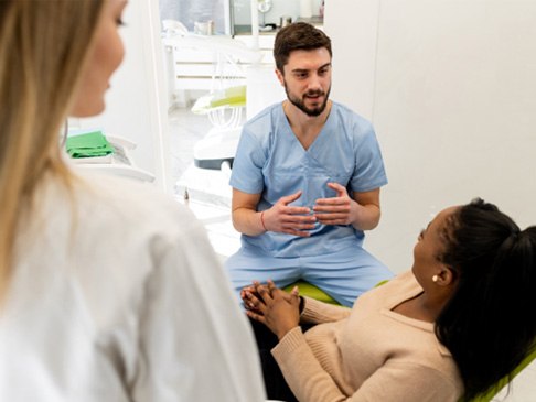 woman talking to cosmetic dentist in Ledgewood   