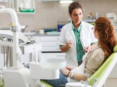 Dentist explaining the cost of dental emergencies