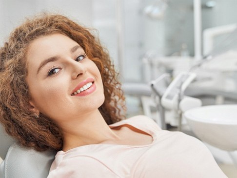 Female patient smiling after visiting emergency dentist in Ledgewood, NJ