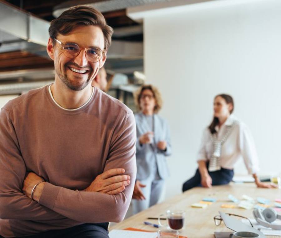 a man smiling after receiving tooth colored fillings