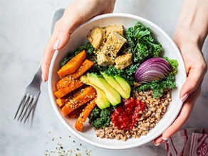 Closeup of patient holding healthy lunch