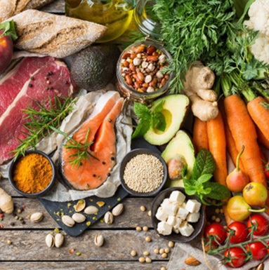 Various healthy foods laid out on a wooden table