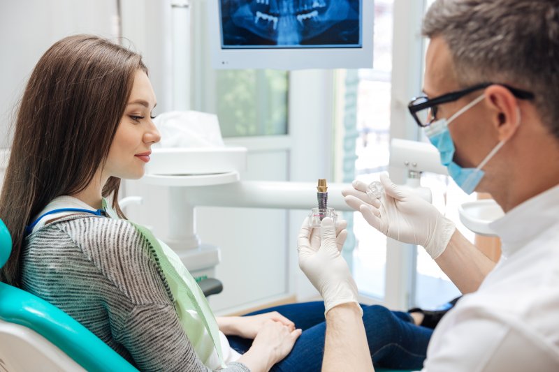 Dentist talking to a patient about tooth replacement